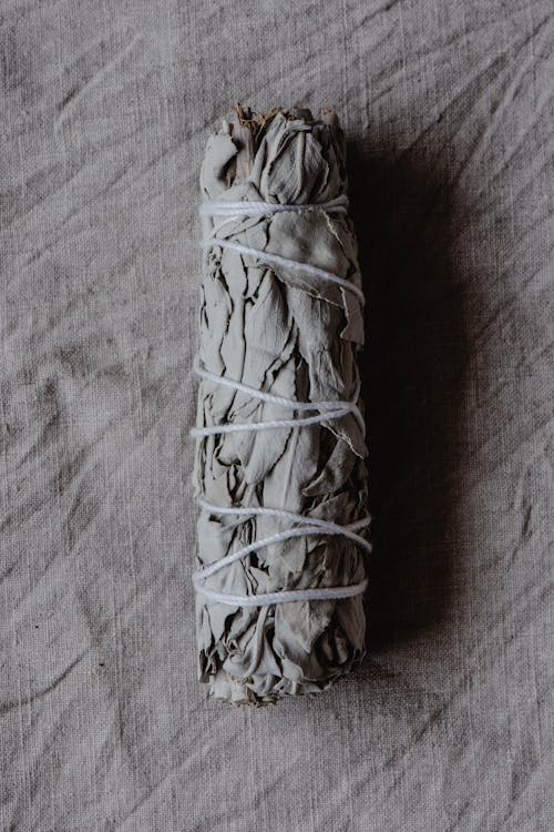 Free A Bundle of White Sage on Gray Textile Stock Photo