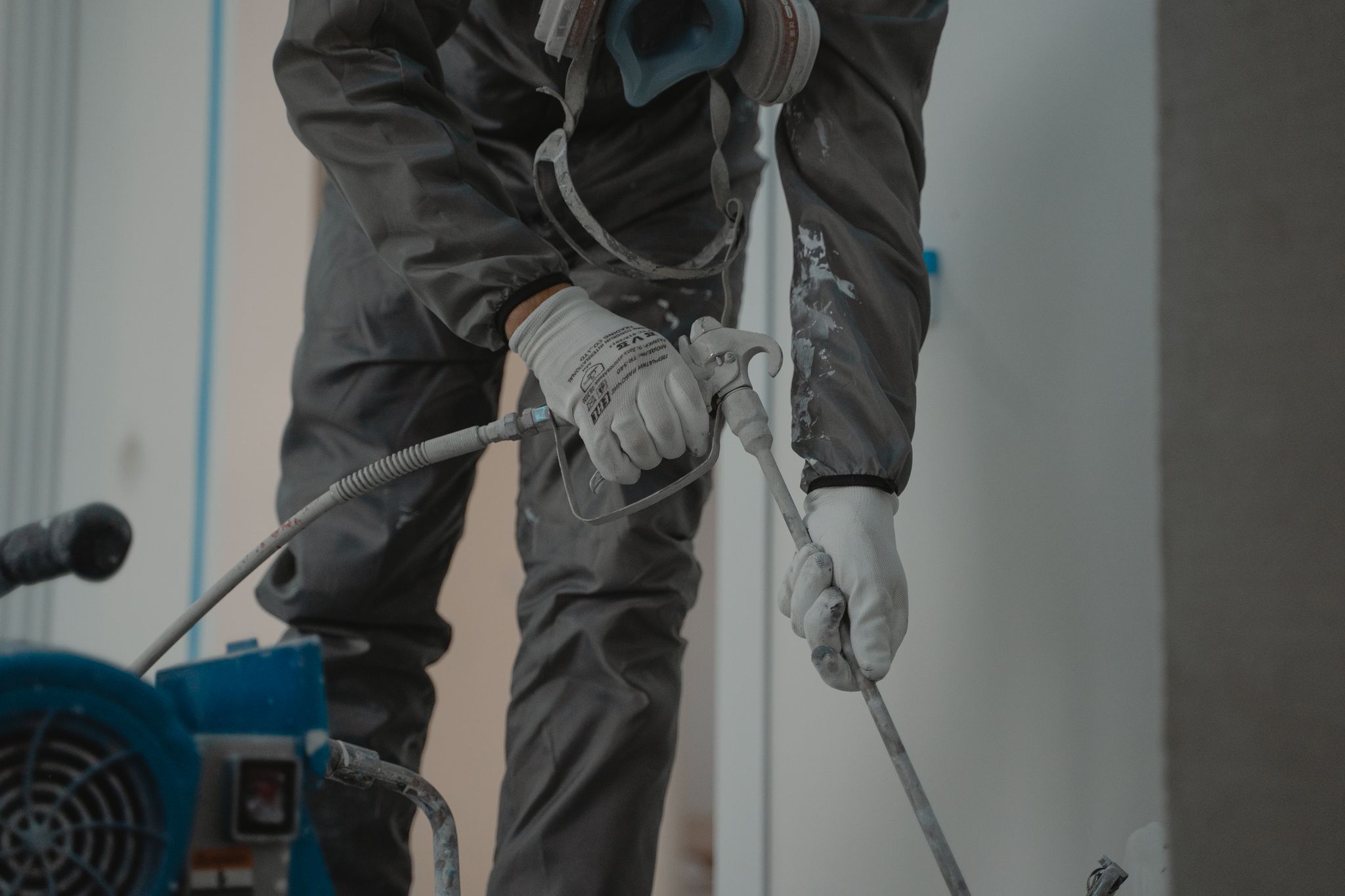 Painter painting a wall