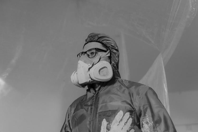 Grayscale Photography Of A Person Wearing Gas Mask