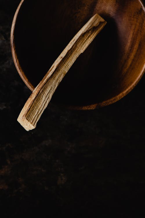 Free A Piece of Palo Santo in a Wooden Bowl Stock Photo