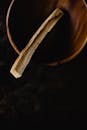 A Piece of Palo Santo in a Wooden Bowl