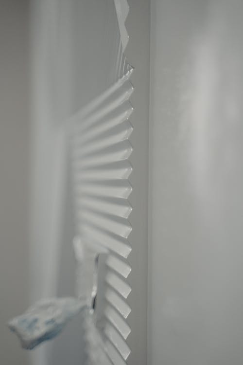 Close-Up Shot of White Window Blinds 
