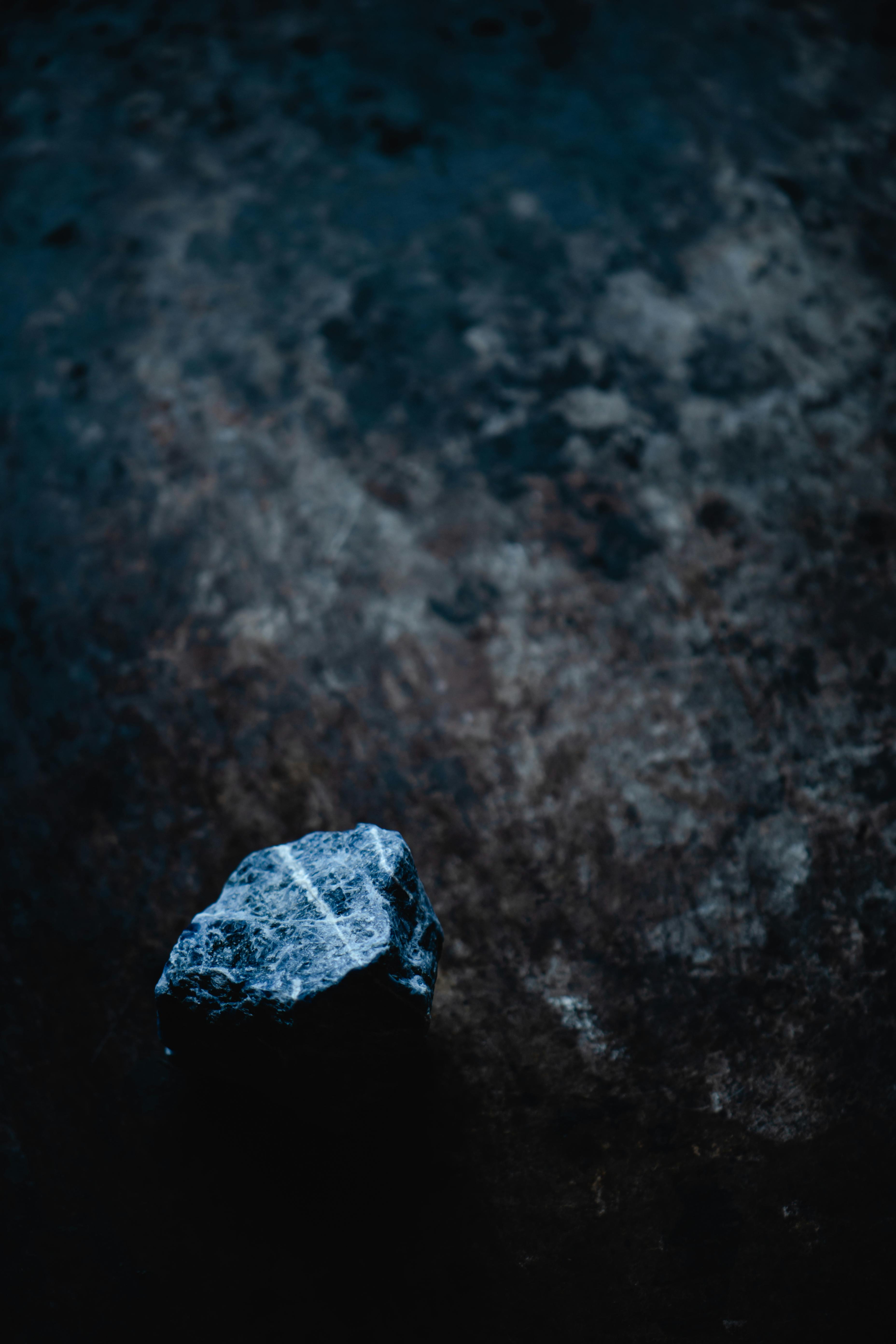 gray stone on black surface