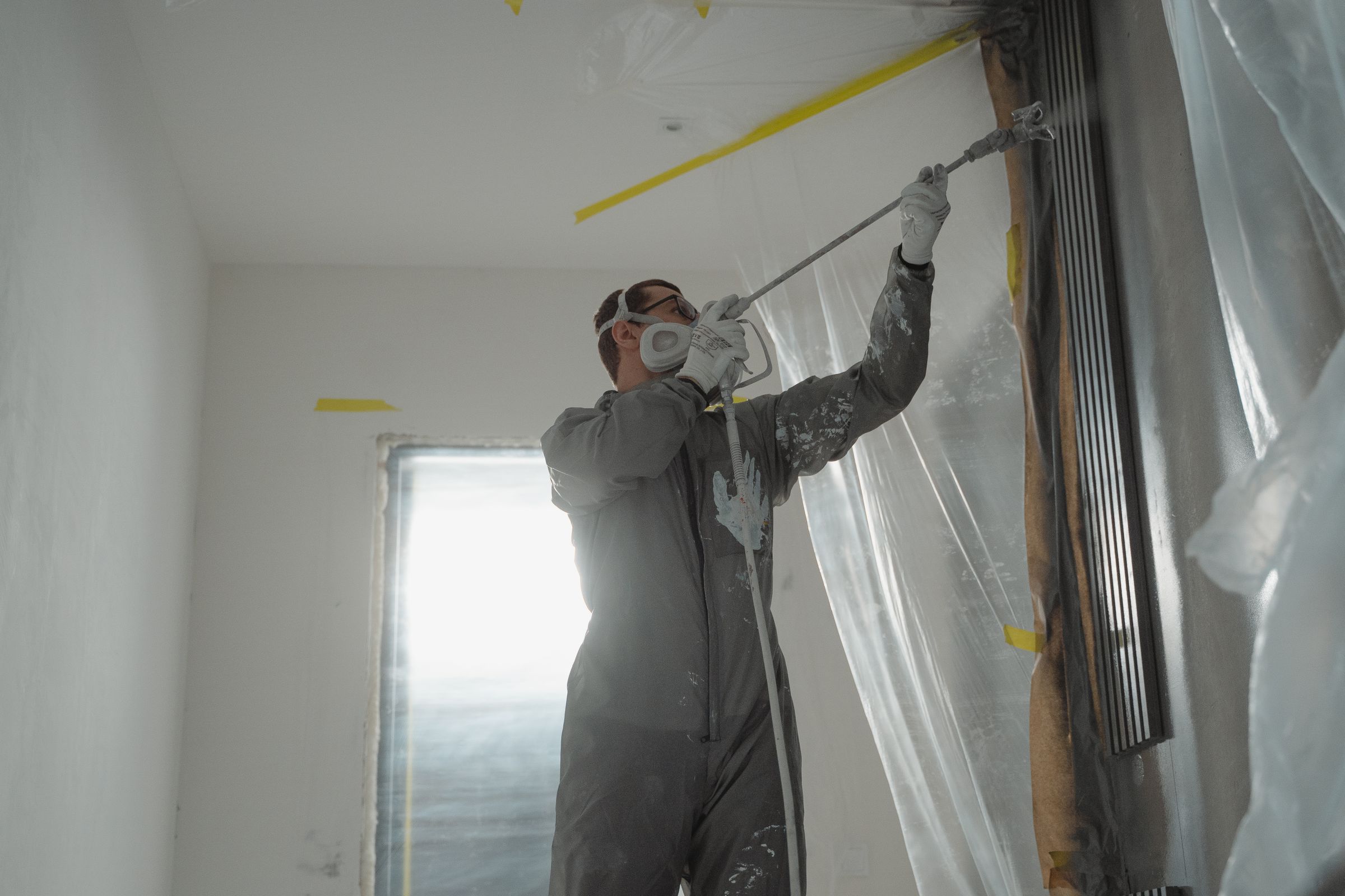 Painter applying coating