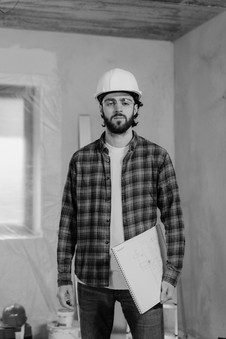 Site engineer wearing a white hard hat on a project