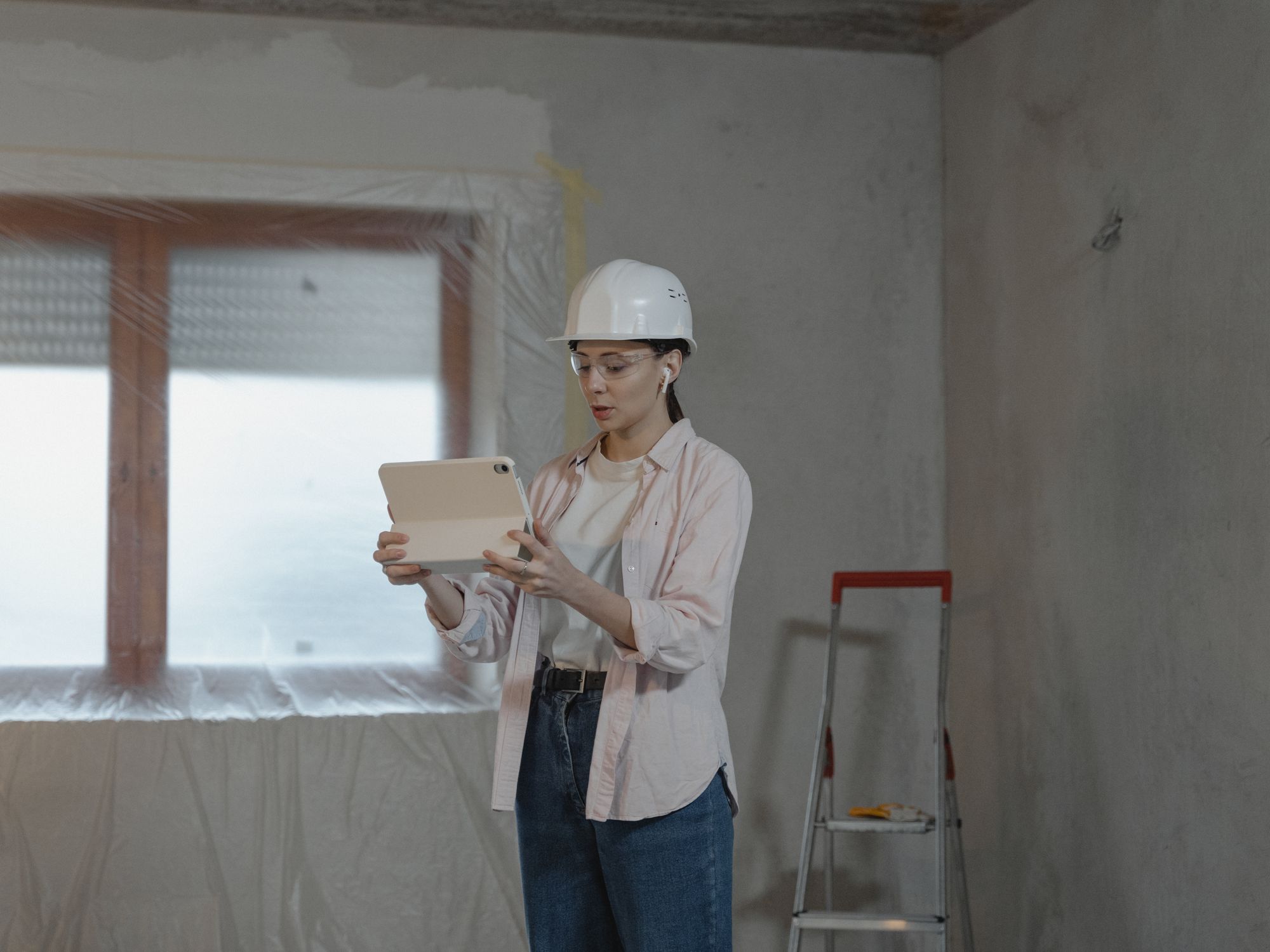 Painters & Decorators in Park Royal, London — professional decorator painting a wall with a roller