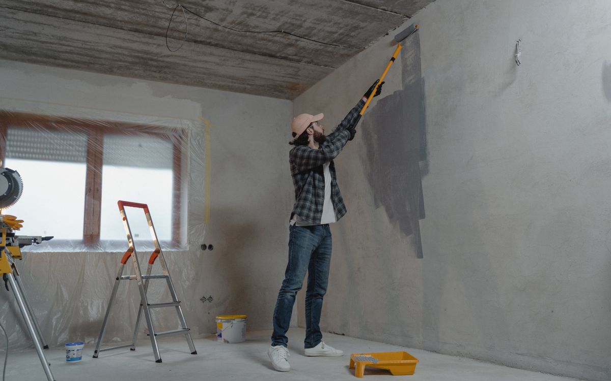 Builder reviewing drawings on site
