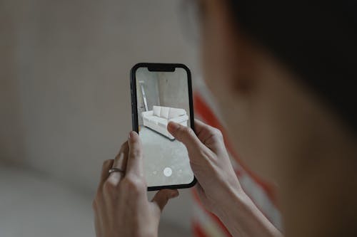 Free Person Holding Black Iphone Stock Photo