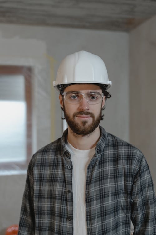 Free Man in Black and White Plaid Button Up Shirt Wearing White Hard Hat Stock Photo