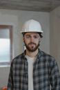 Man in Black and White Plaid Button Up Shirt Wearing White Hard Hat