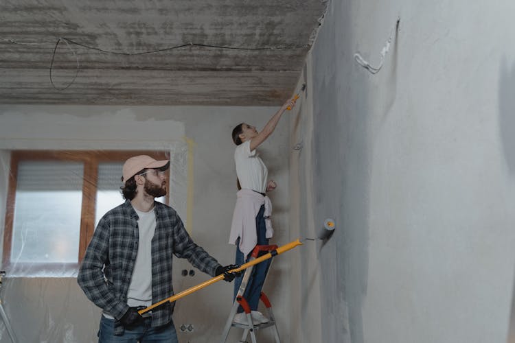 Couple Painting The Room