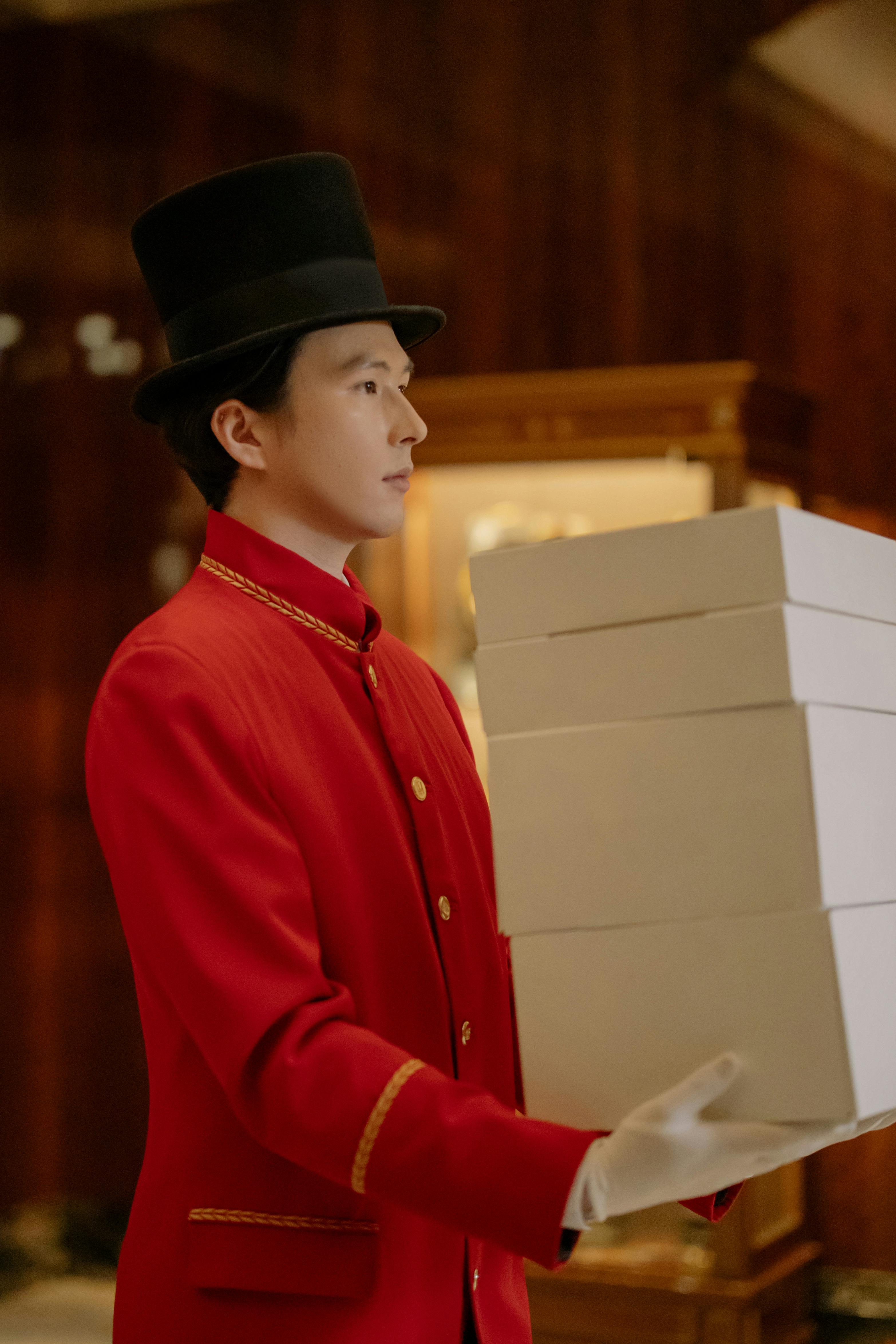 man carrying white boxes