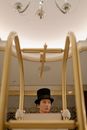 Man in Black Hat Pushing a Cart