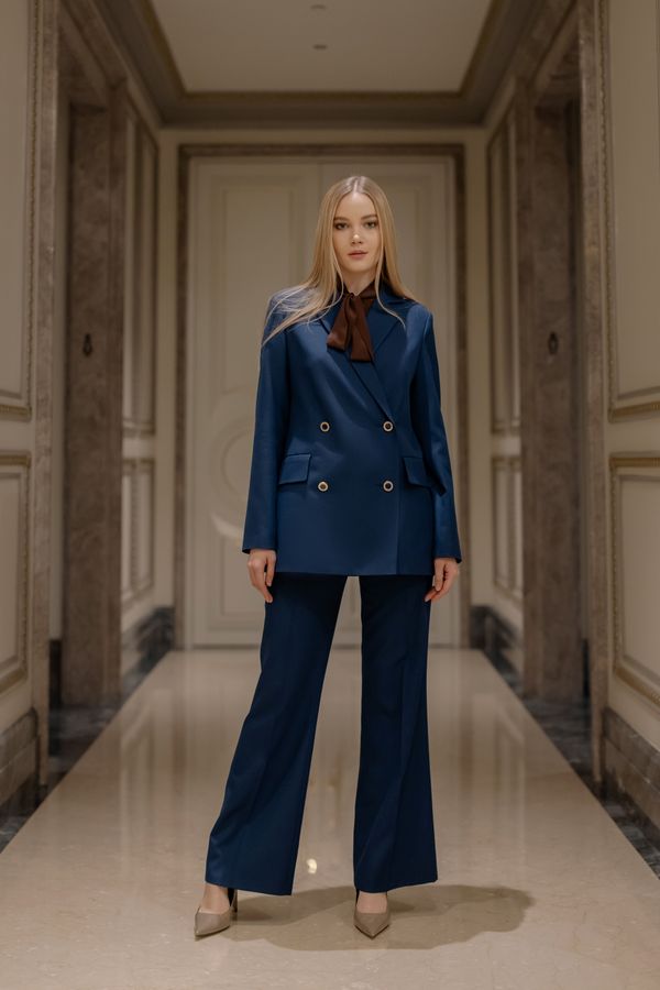 Woman in an elegant navy suit for the evening