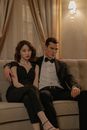 Couple Wearing Black Suit and Dress