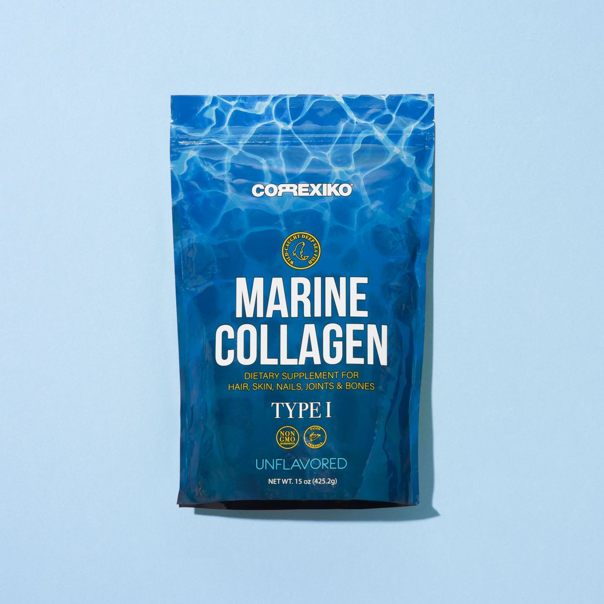 Collagen powder supplement jar with measuring scoop on a soft blue background, representing the science behind collagen products.