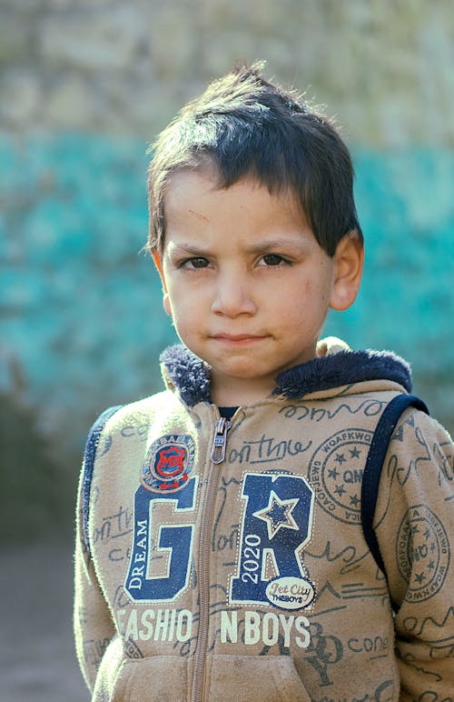 Free Young Boy Wearing Brown Jacket  Stock Photo