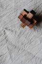 Brown Wooden Blocks on White Textile