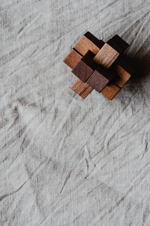 Brown Wooden Blocks on Gray Textile