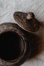 Brown Wooden Round Ornament on White Textile