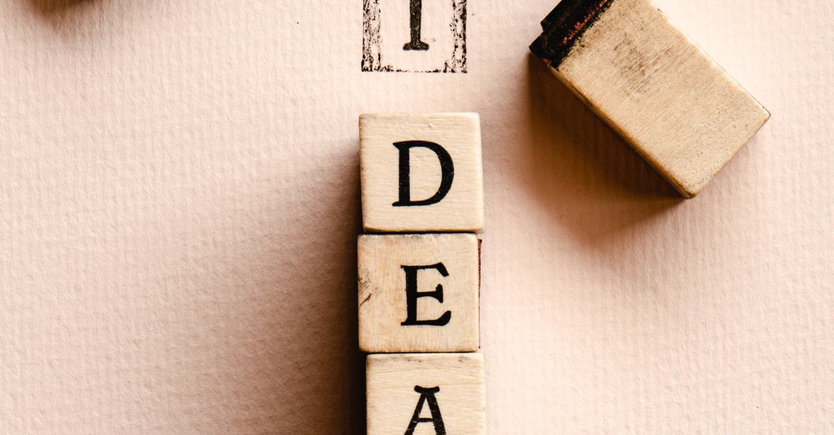 Close-up of letter stamps forming the word 'IDEA', inspiring creativity and knowledge.
