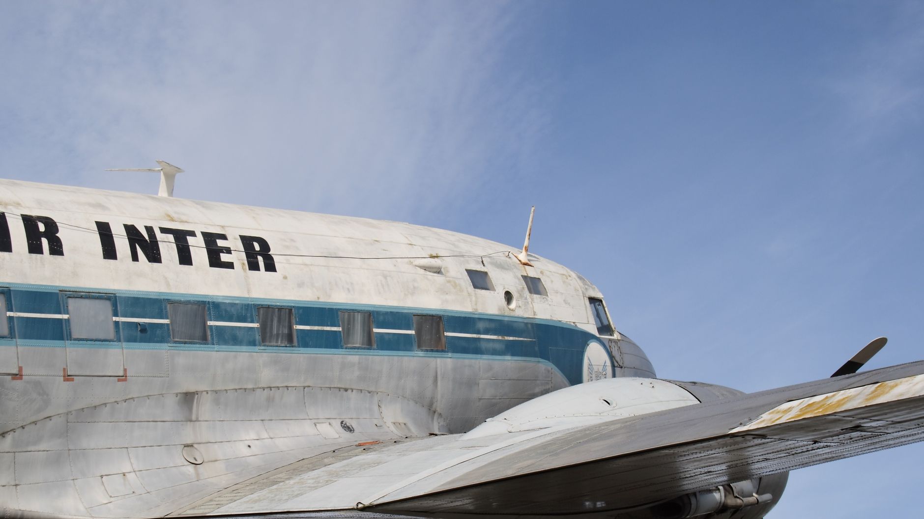 Close-up of a vintage aircraft with visible propeller against a clear blue sky. — free online jigsaw puzzle on JigsawPuzzlesFreeOnline.org