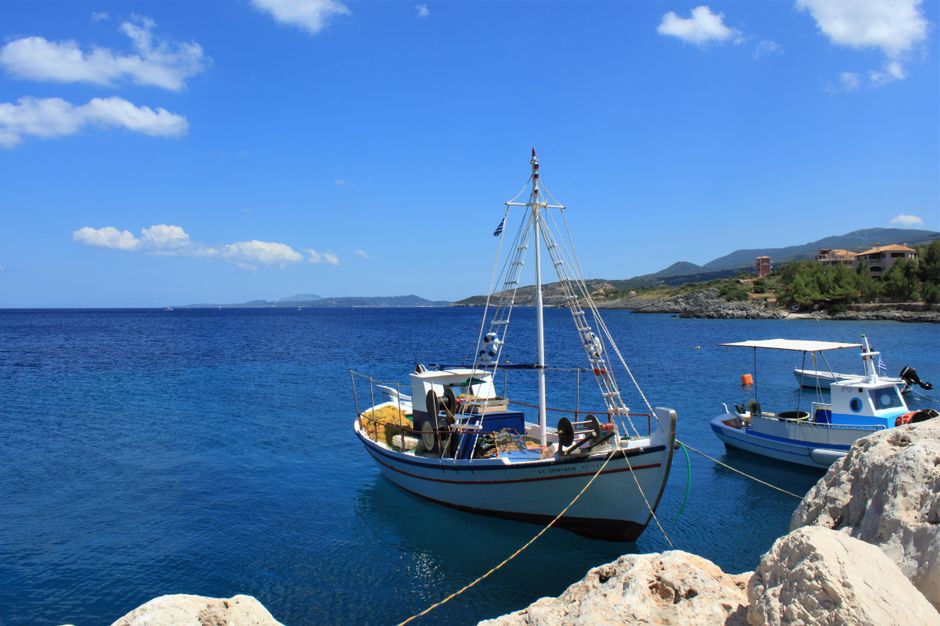 Ultimate Semi-Private Sailing Cruise to Iconic Bays (Shore-Ex Top Choice) Review: Your Ultimate Rhodes Sailing Adventure Review 2026 - Serene view of fishing boats docked on the crystal clear waters of Zakynthos, Greece.