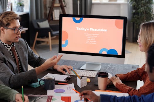 Team engaged in a productive office meeting discussing business trends and planning strategies.