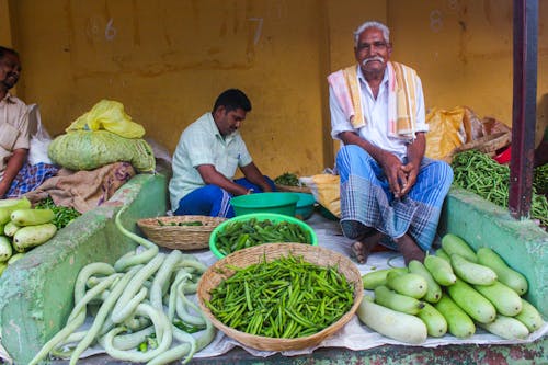 Men Selling Fresh Vegetables