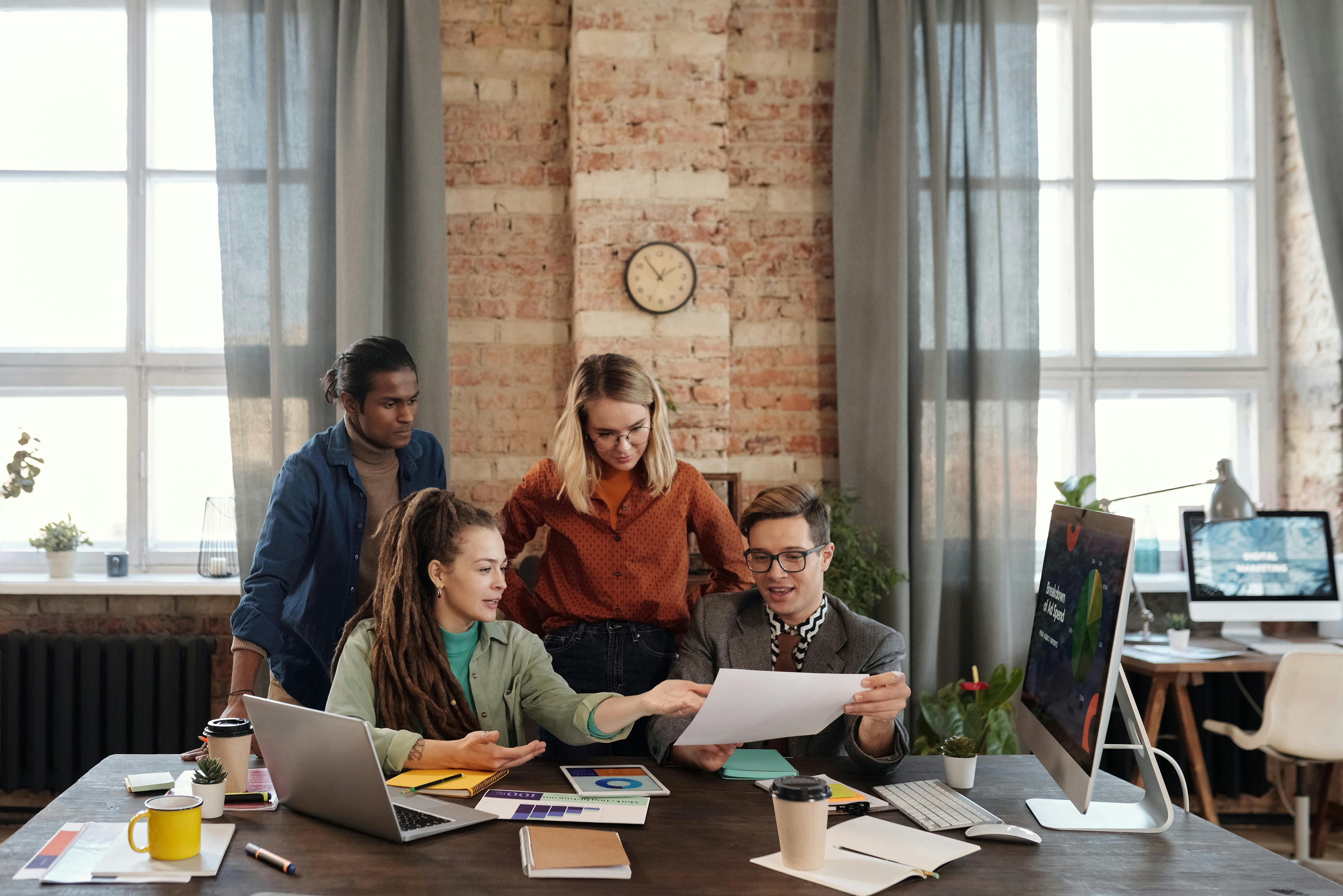 a group of people discussing marketing plans