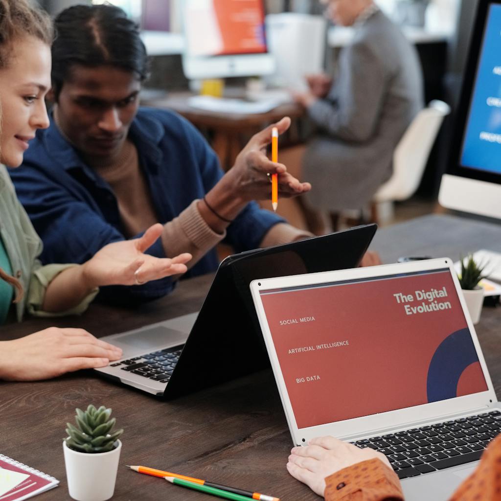 Team discussing digital marketing strategies with laptops and AI concepts.