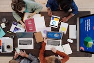 A Group of People Discussing Charts