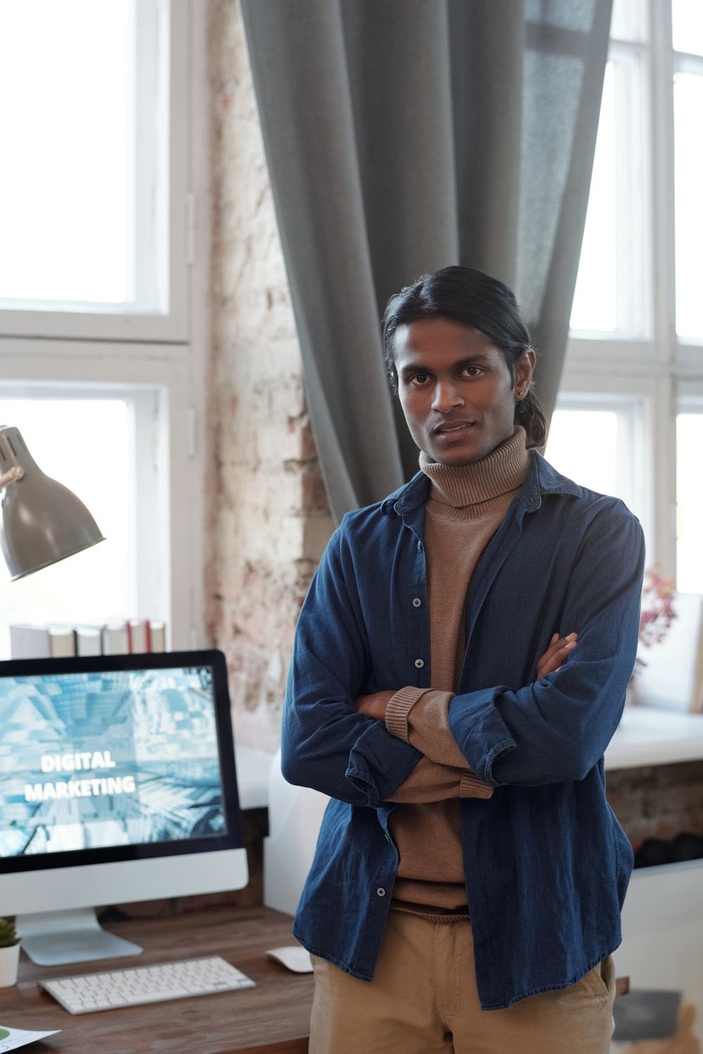 Indian marketer working on a digital marketing dashboard at home
