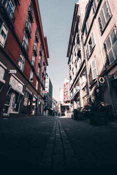 Low-angle urban street view of Strasbourg, showcasing European architecture with vibrant, historic buildings.