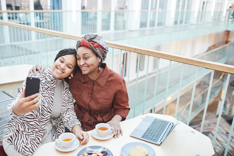 Women Having Selfie While Drinking Tea