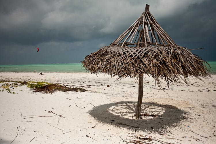 Wooden Umbrella Destroyed By Wind On Sandy Beach