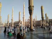 A serene day at Al-Masjid an-Nabawi in Medina, showcasing its stunning architecture and peaceful atmosphere.