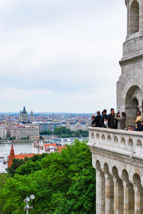 Free Tourists admire Budapest skyline from Fisherman's Bastion. Iconic view and architecture captured in vibrant detail. Stock Photo