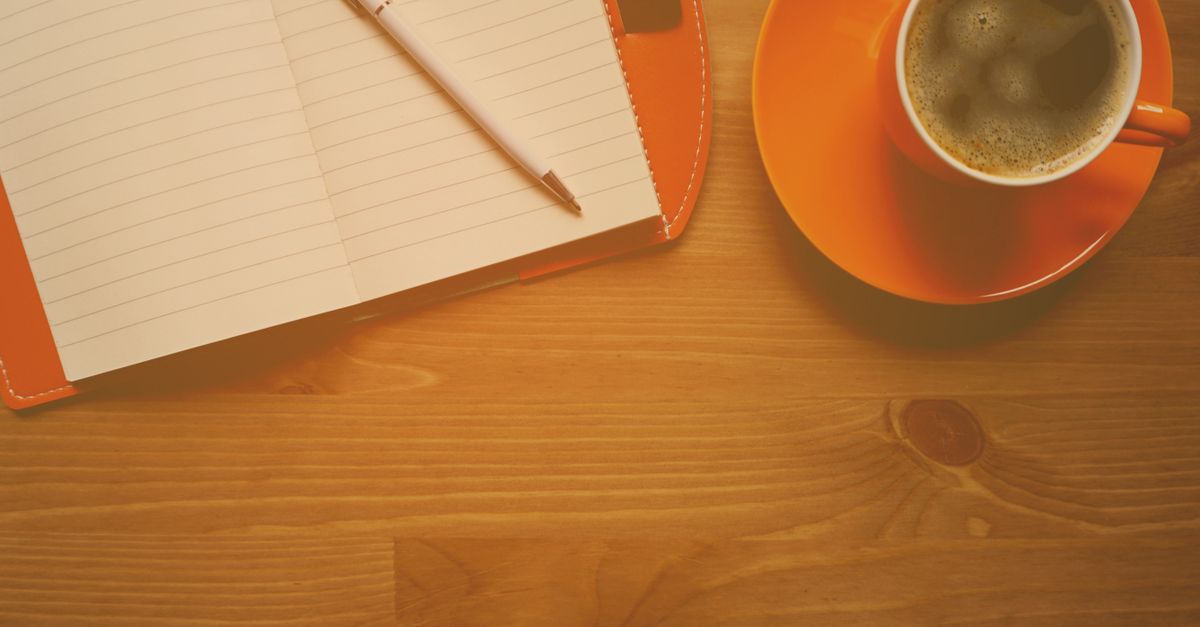 cozy slow living morning coffee and journal on wooden table