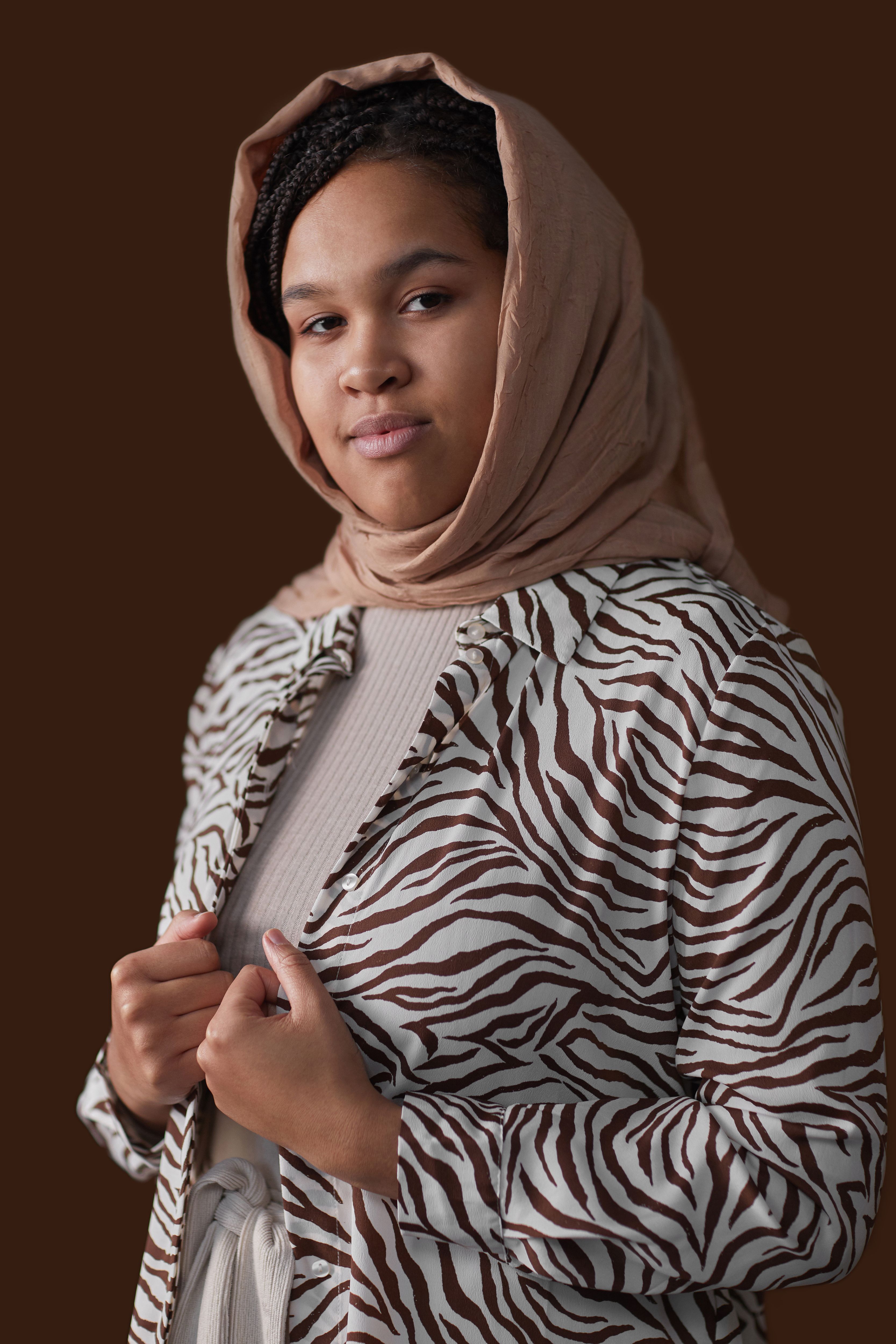 Person in Brown Hijab and White and Brown Stripes Long Sleeve Shirt ...