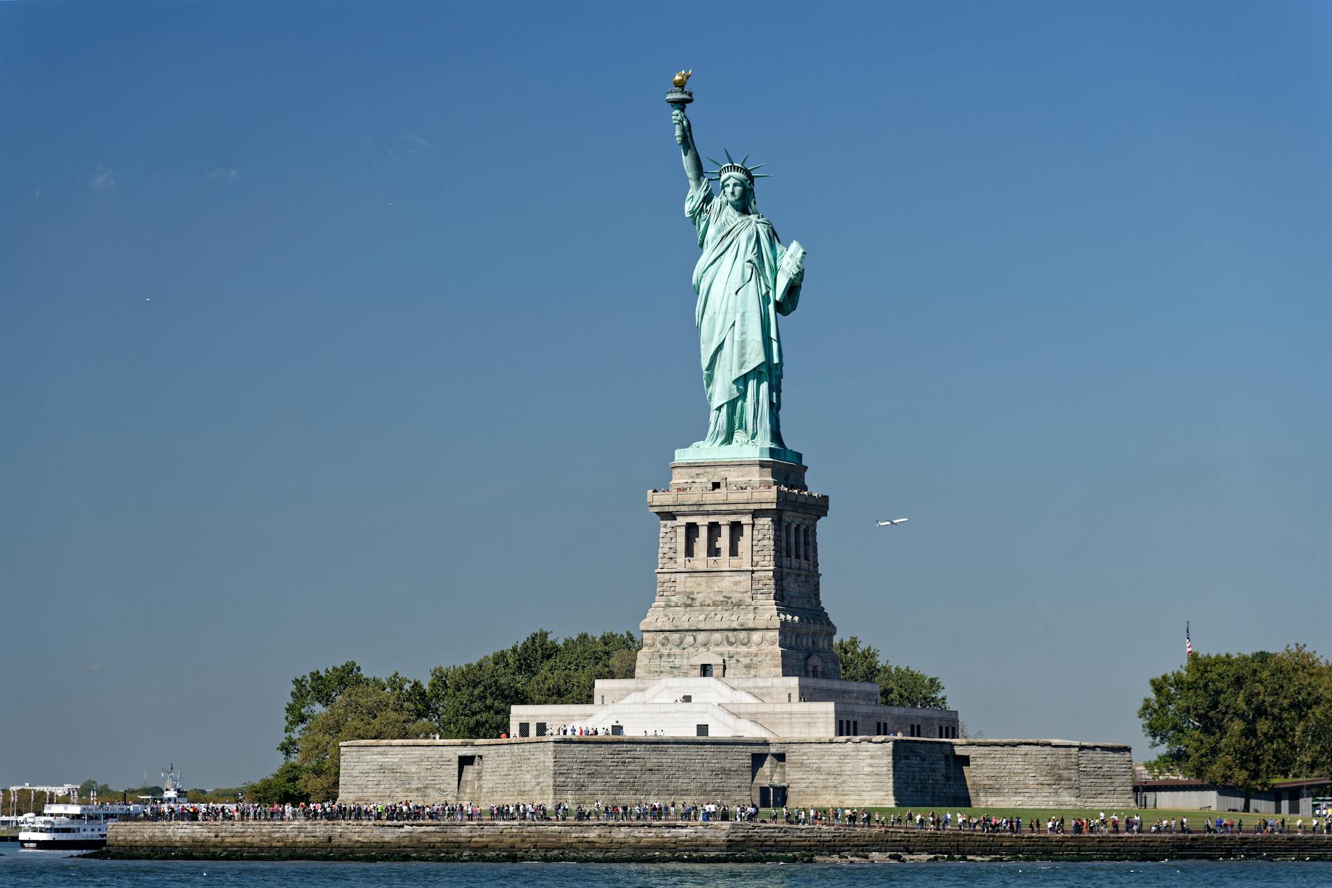 View of the Statue of Liberty with clear blue skies on Liberty Island, New York.