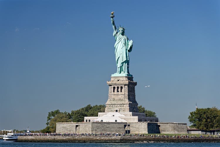 People Under The Statue Of Liberty