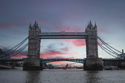 Beautiful view of Tower Bridge in London during a vibrant sunset, showcasing the city's iconic skyline.