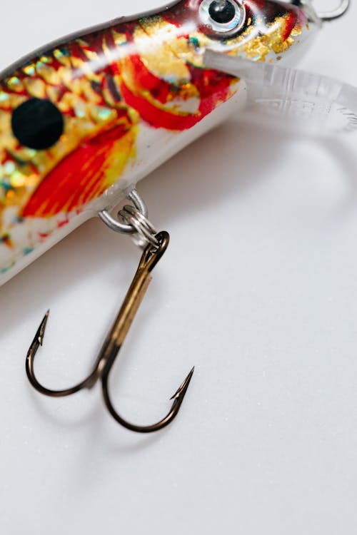 Vertical Close up of a Red and Yellow Bait with a Hook