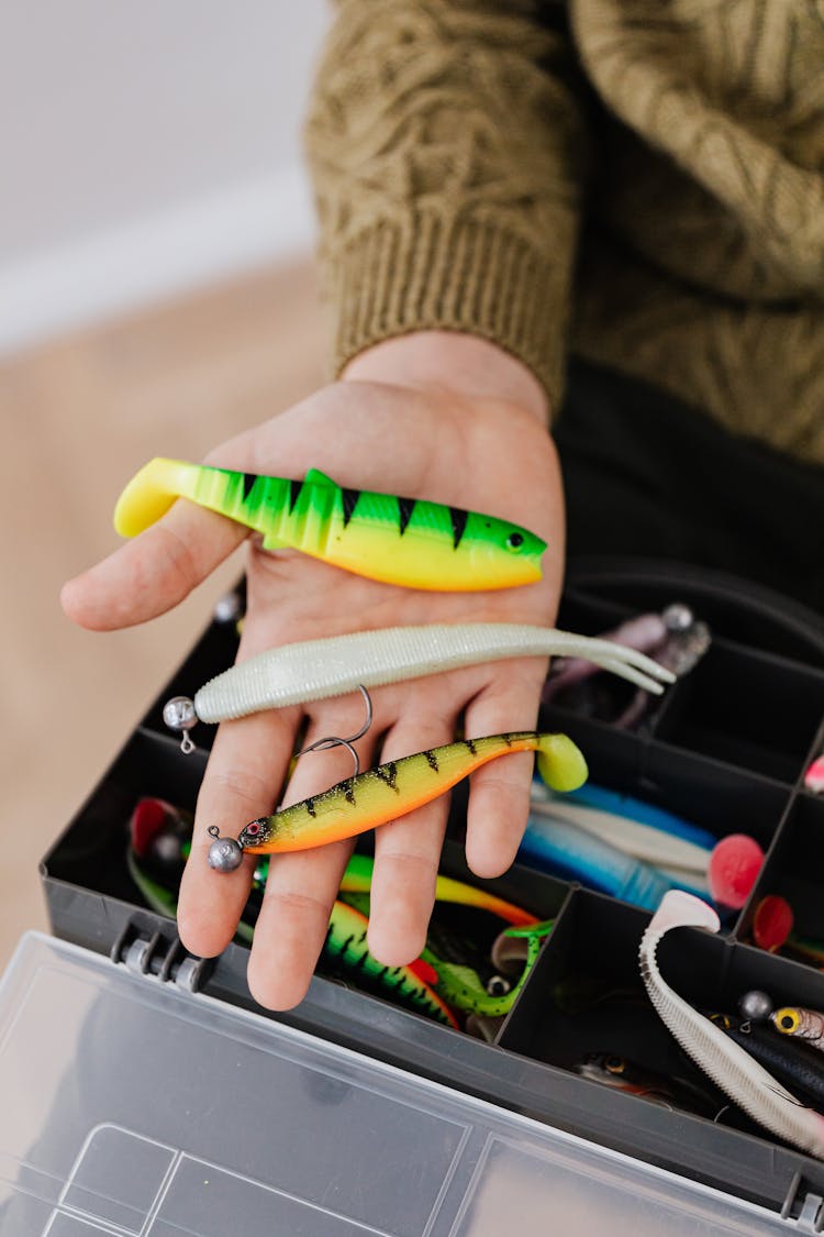 Fishing Lures On A Person's Hand