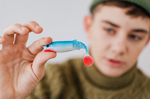 Man Holding a Fishing Lure