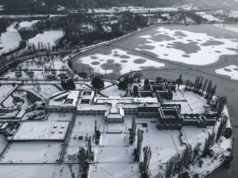 Drone Shot of a Hotel beside a Frozen Lake