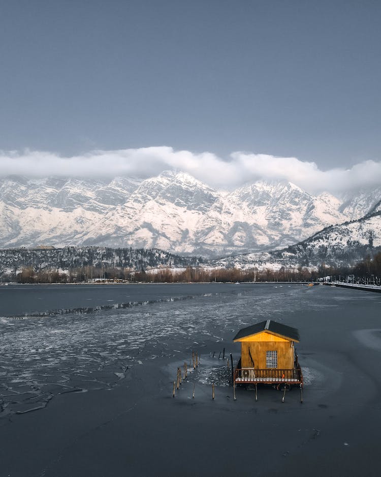 Wooden House On A Frozen Lake