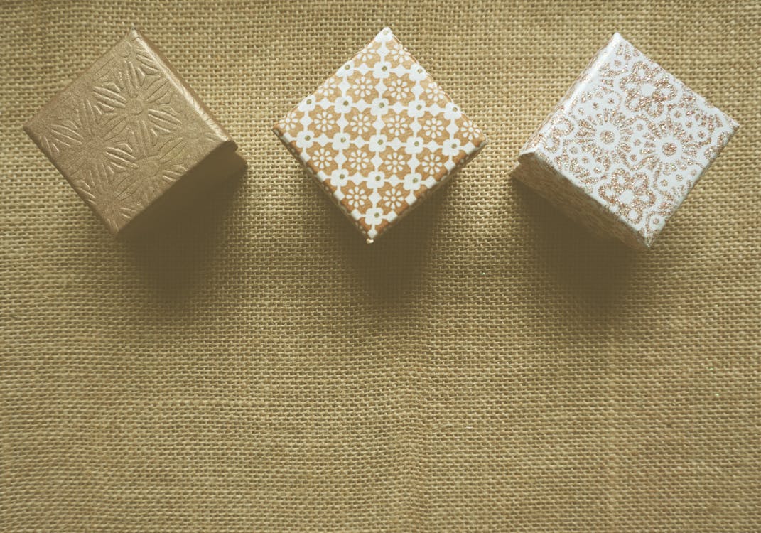 Free Three Brown and White Gift Boxes Stock Photo