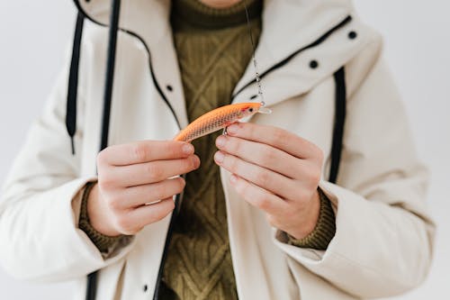 Person Holding a Fishing Lure